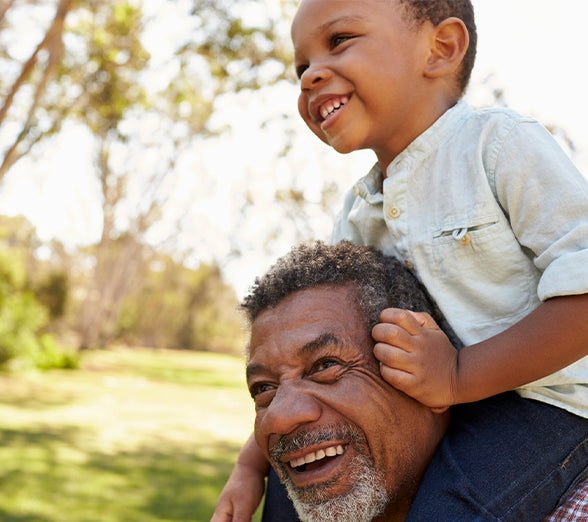 Dad holding son on shoulder