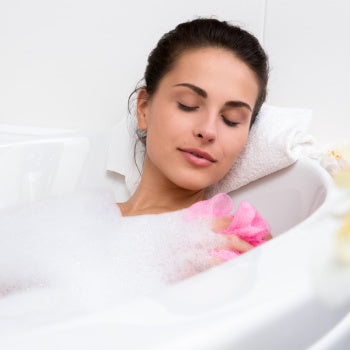 Mom taking a bath for self care 