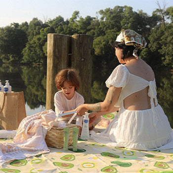 Mom having a picnic near the lake
