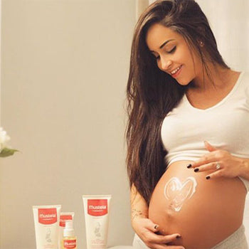 Mom apply stretch marks cream on 4 months pregnant belly