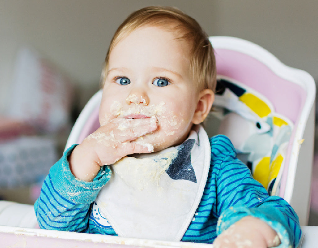 Baby feeding himself on a 9 month old feeding schedule