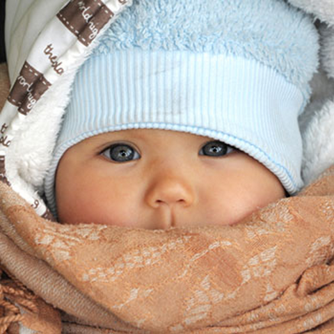 newborn with eczema in warm jacket