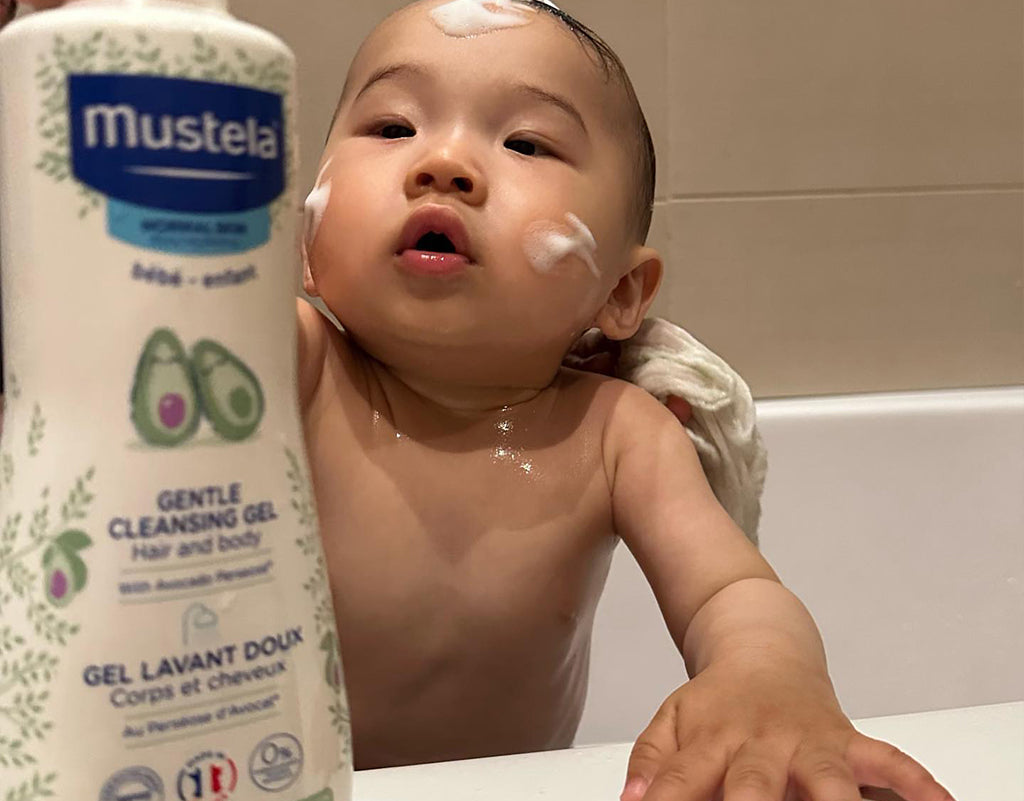 Baby taking a bath with different types of diaper rash
