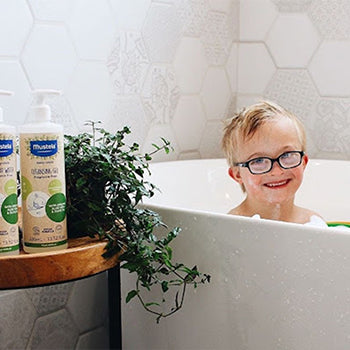 Young boy taking a bath with aloe vera for skin products