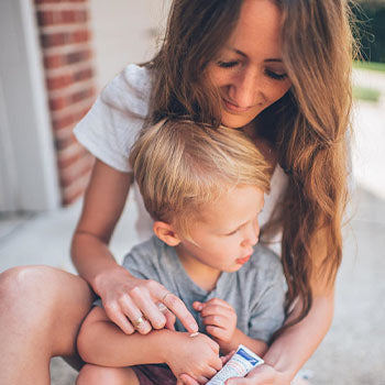 mom using avocado benefits for skin on child's scar