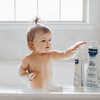 Little girl taking a bath with avocado benefits for skin