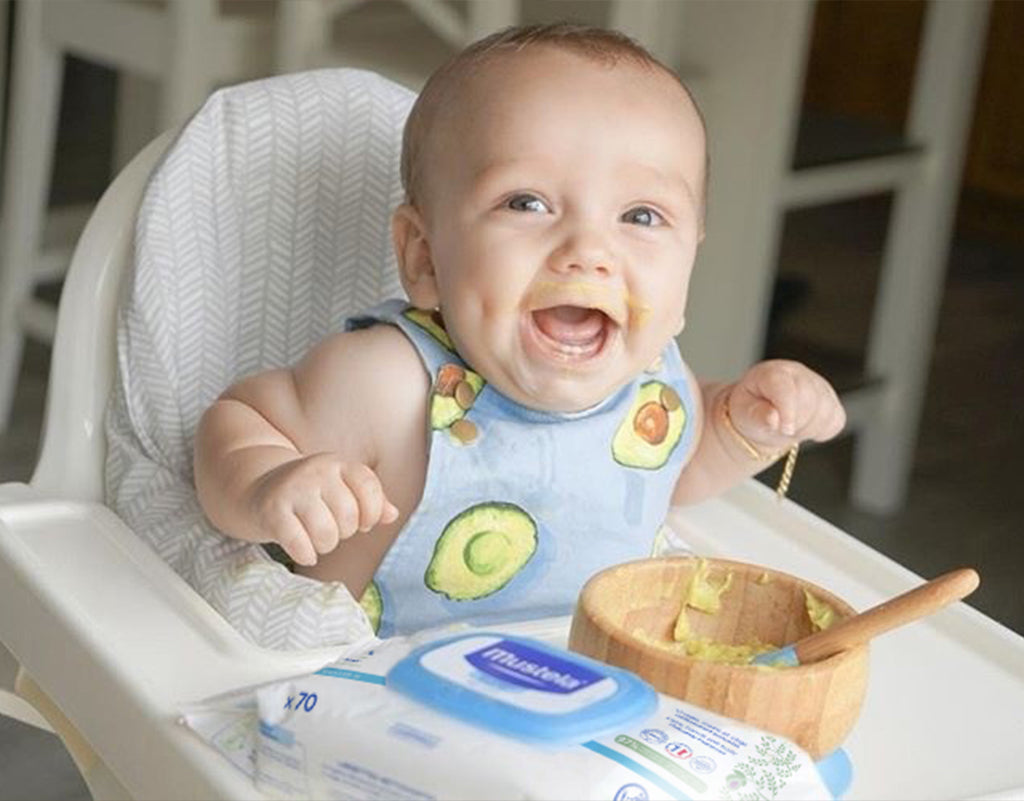 Happy boy doing baby-led weaning