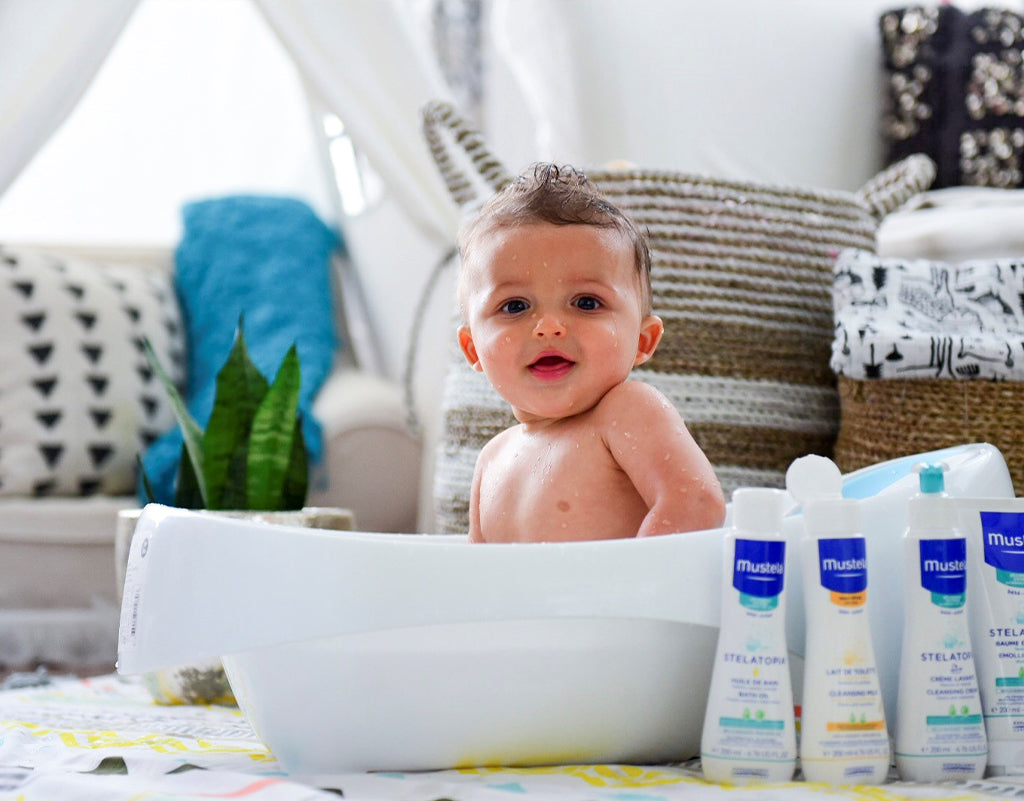 baby taking a bath to help with baby eczema on face