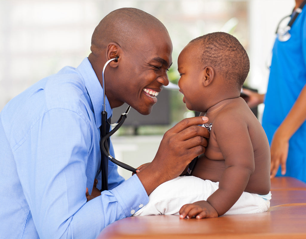 Doctor checking health of young child