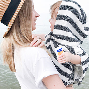 Mom protecting baby from baby sunburn