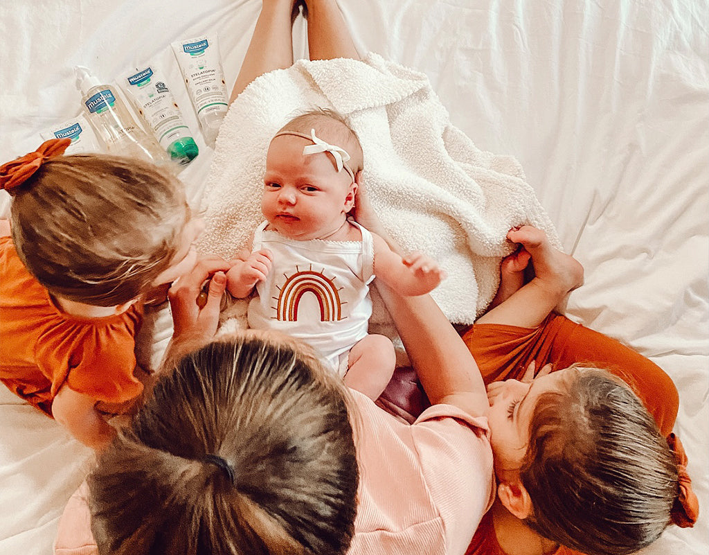 Family around baby who won’t burp