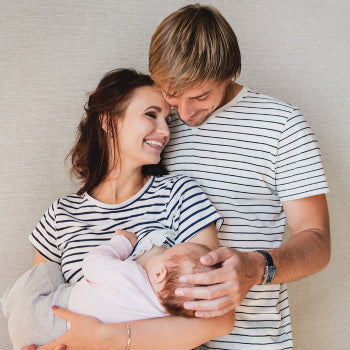 Two happy parents who know breastfeeding facts