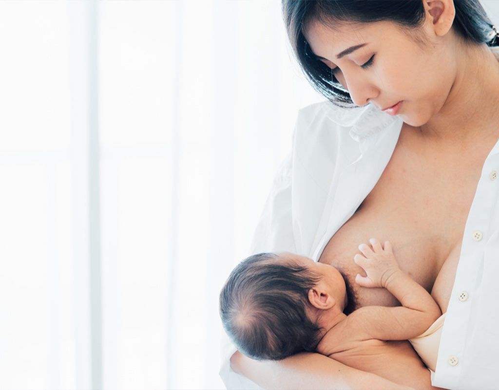 New mom breastfeeding newborn