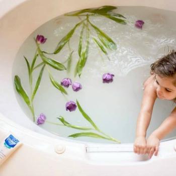 Baby in a bath to help with child eczema