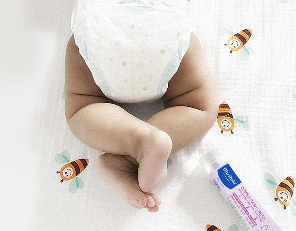 Mustela Diaper Rash Cream and a baby in a diaper