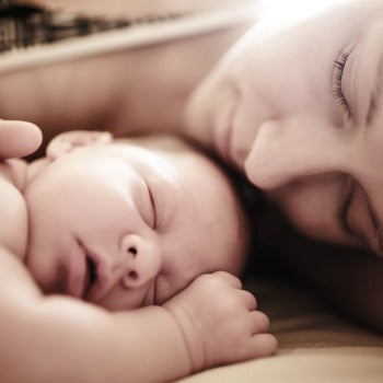 Mom and newborn sleeping