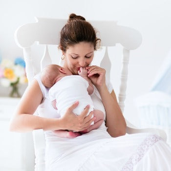 Woman rocking her baby