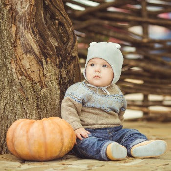 Child with eczema outside during the fall