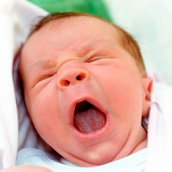 Baby crying with tongue-tie