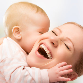 mom and baby laughing