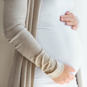 pregnant woman getting ready to prepare a baby registry checklist 