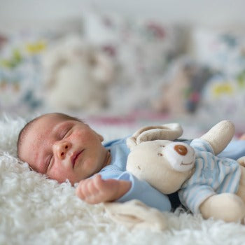 newborn relaxing after receiving natural eczema treatment