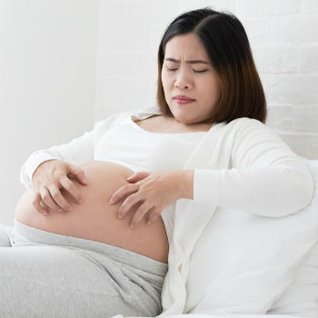 Pregnant woman with symptoms of pregnancy rash