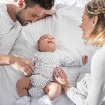 mother and father beginning sleep training with their baby