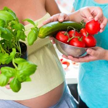 couple holding food to eat when pregnant