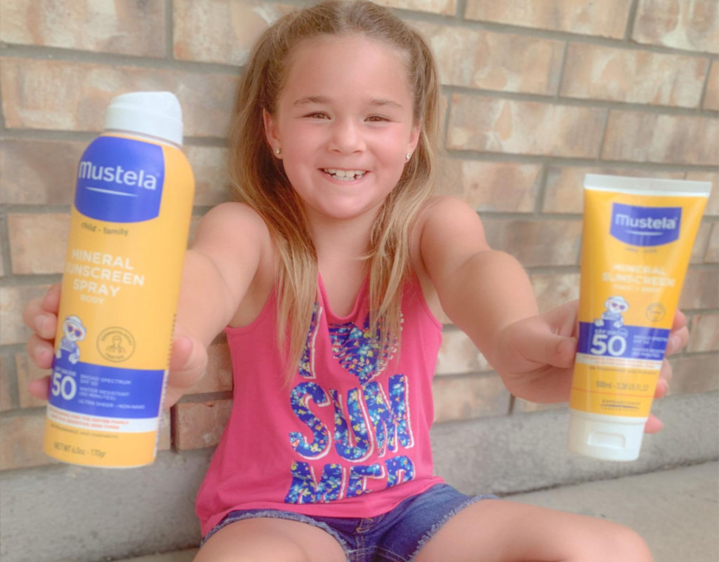 Kid holding sunscreen knowing does sunscreen expire