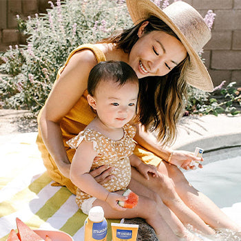 Mom with daughter at the pool