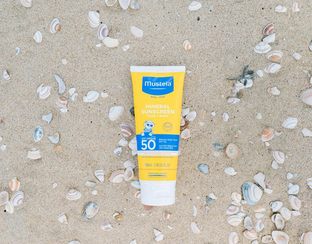 Bottle of mineral sunscreen at the beach