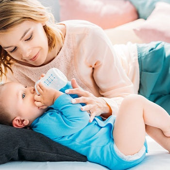 Mom learning how often should I pump while feeding baby