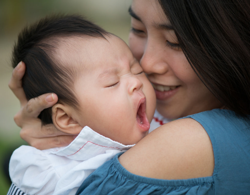 Mom learning how to calm a fussy baby