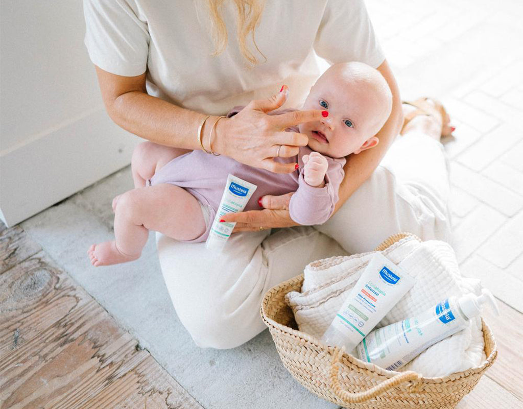 Mom learning how to clean baby ears