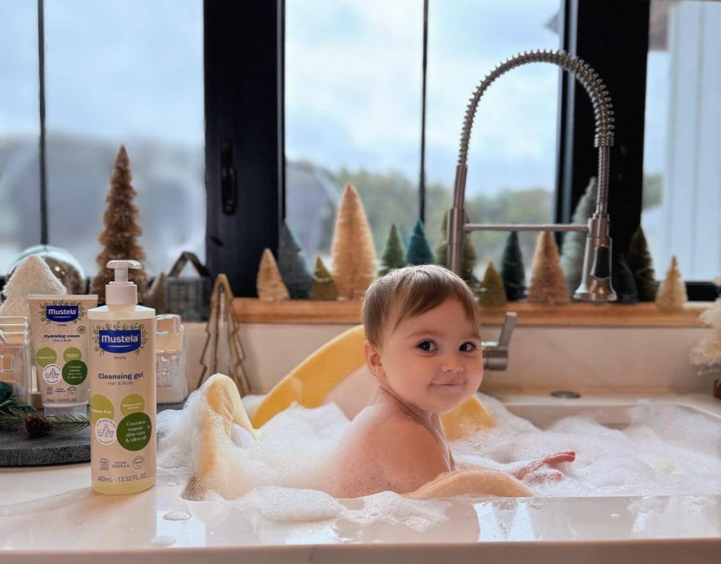 baby in sink for bath time