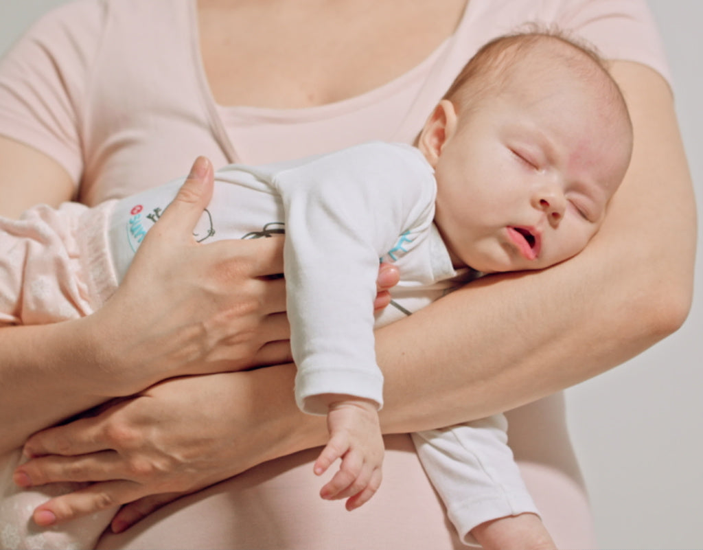 how to hold a baby - The Belly Hold