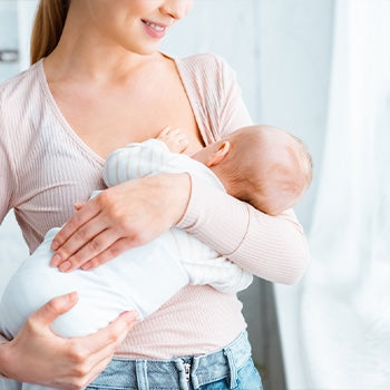 Mom breastfeeding newborn 