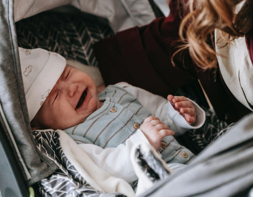 baby crying in a stroller