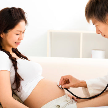 Pregnant woman having a check up