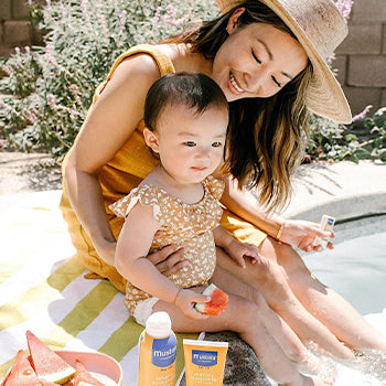 Mom with daughter at the pool