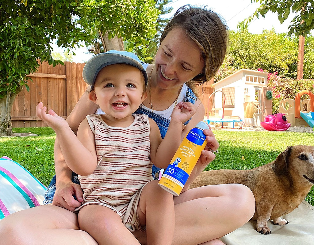 Mom on a picnic with baby while using sunscreen with non-nano zinc oxide