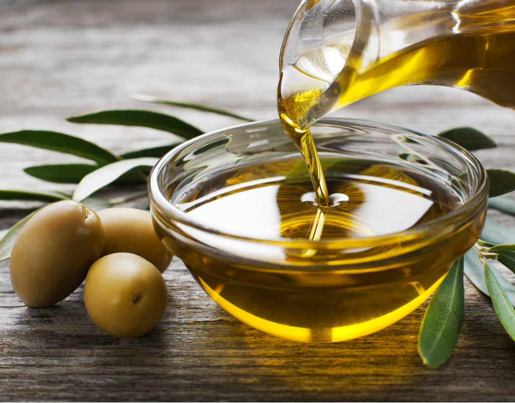 Olive oil being poured into a bowl