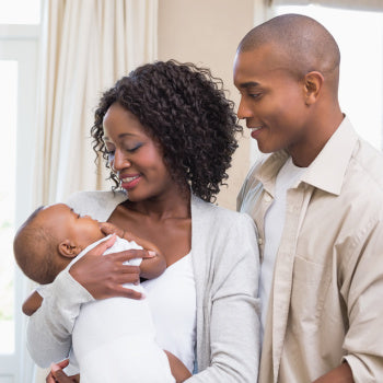 Parents holding newborn baby