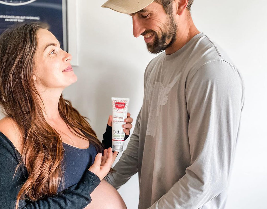 Dad preparing for fatherhood with pregnant Mom