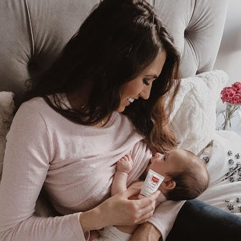 Mom breastfeeding after second pregnancy