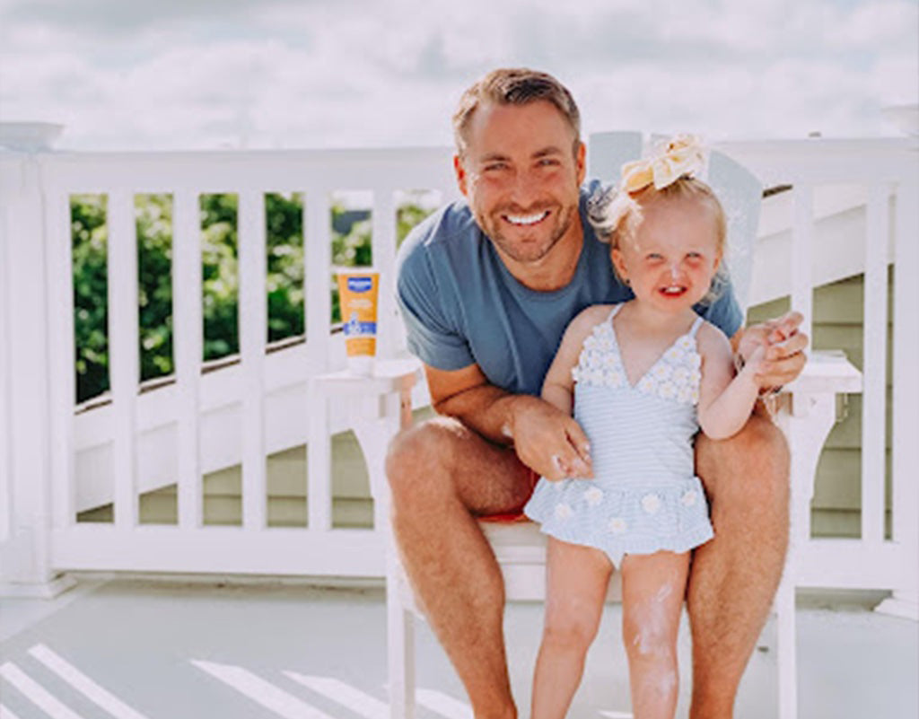 Dad with daughter who uses shea butter for skin