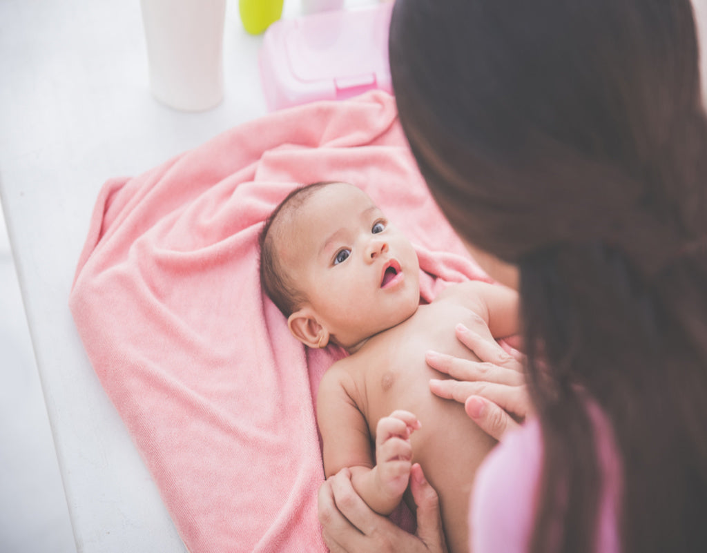 Mom protecting skin barrier on baby