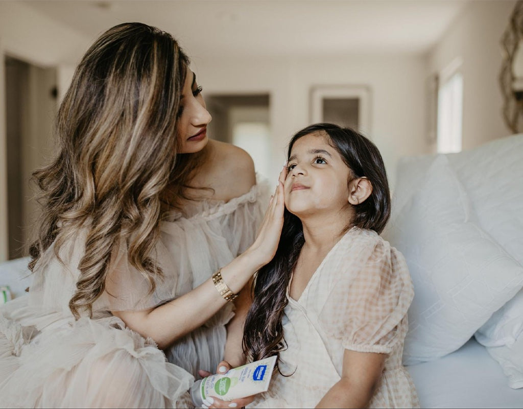 Mom working with a skincare routine for her daughter