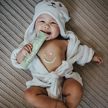 Baby after bath time in a robe
